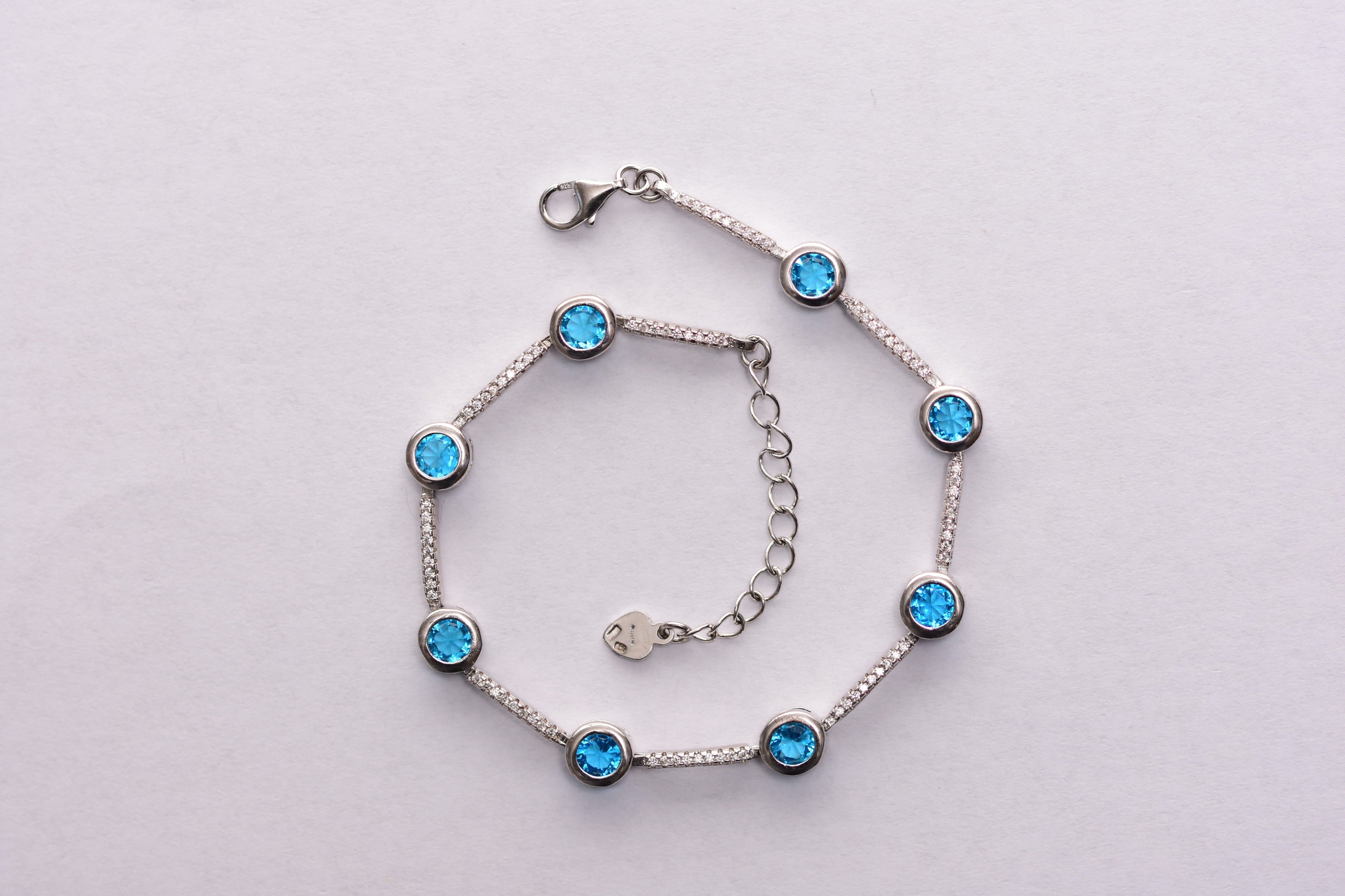 Kék topáz- cirkon karkötő ezüst foglalatban