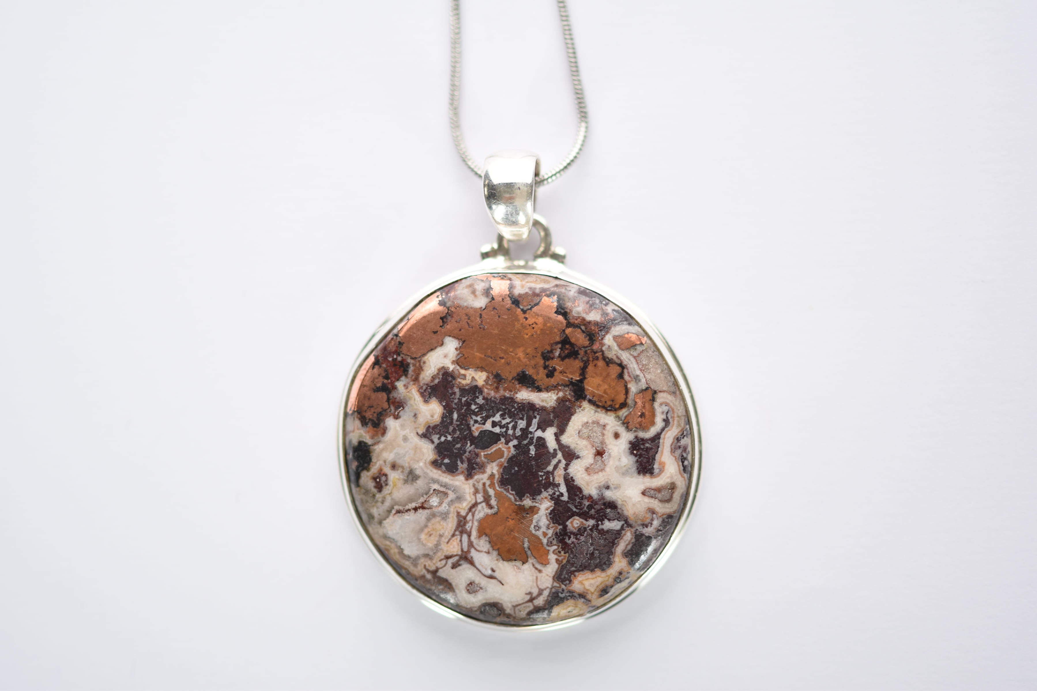 Réz dolomit medál ezüstbe foglalva
