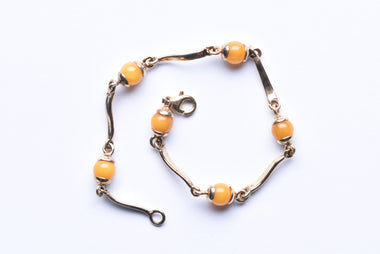 Lengyel borostyán karkötő aranyozott ezüst foglalatban