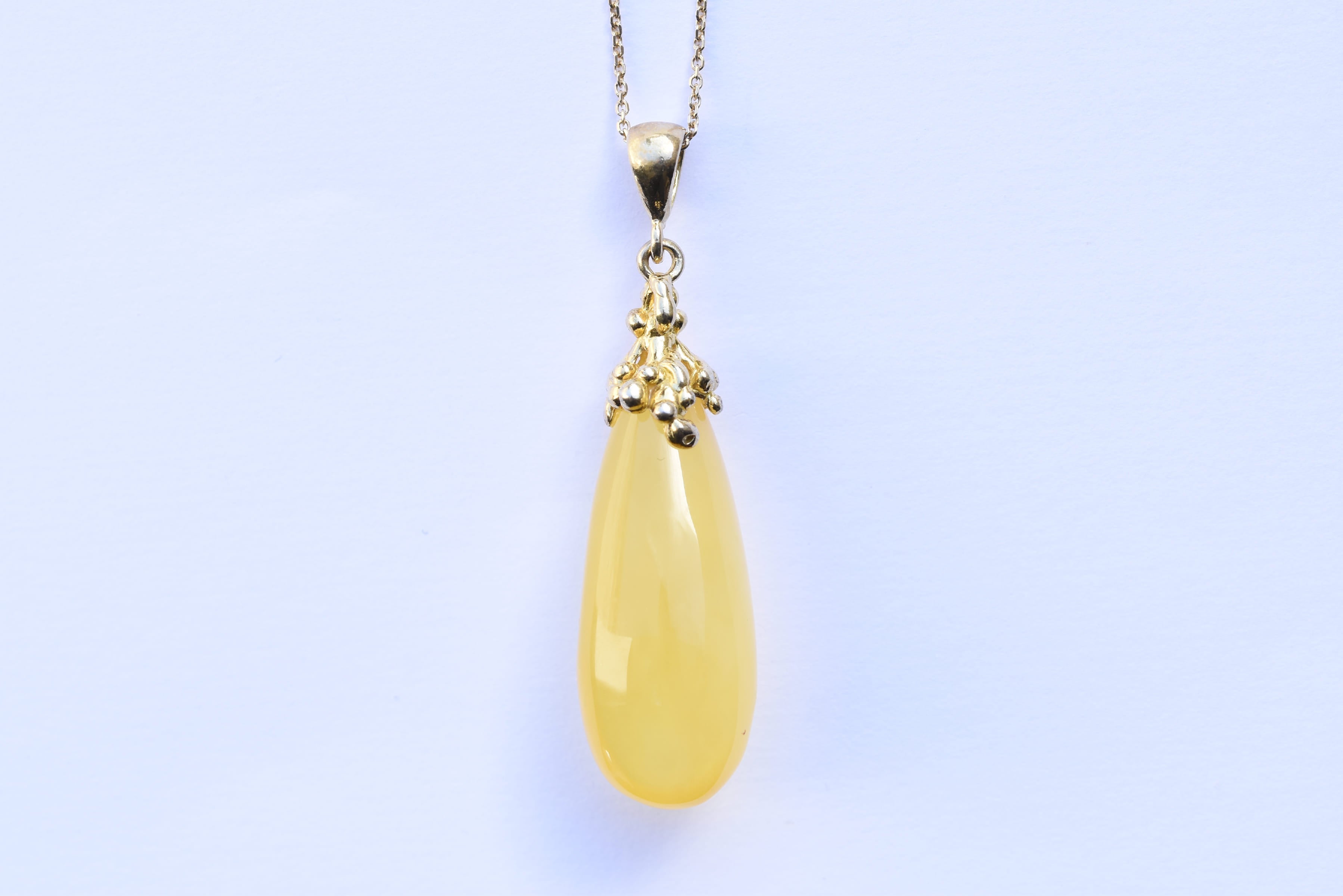 Lengyel borostyánkő medál ezüst foglalatban